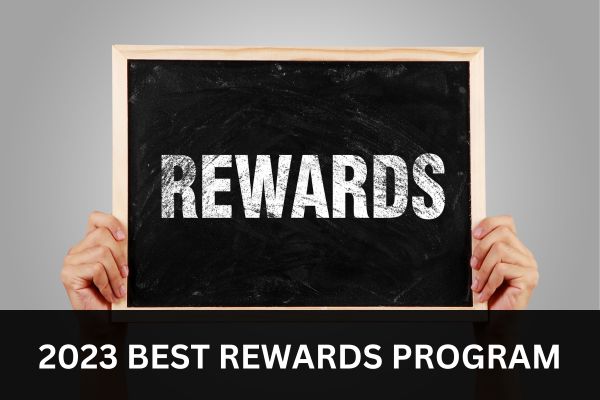 A blackboard showing text "REWARDS" to represent 2023 BEST FOREX REWARDS PROGRAMS